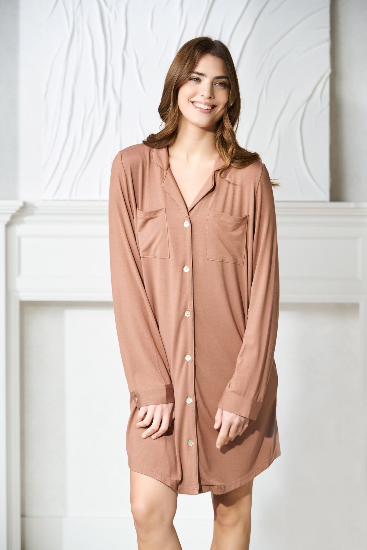 a brunette women wears a mocha mousse brown button up pajama sleep shirt in canada 