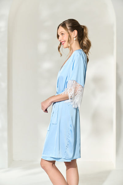 Side view of woman showing off the lace trim sleeves on her powder blue bridal robe