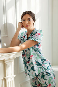 Close up view of woman wearing short sleeve floral print PJ top