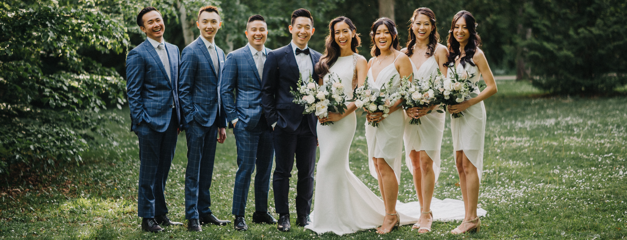 Niagara on the lake bridal party wearing white bridesmaid dresses in Canada