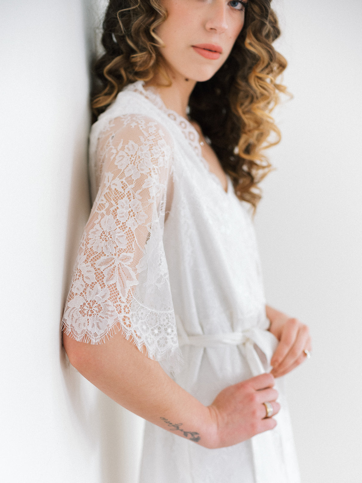 a close up of lace sleeve on by catalfo's lara robe in Denver Colorado