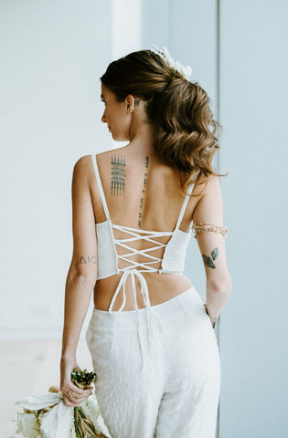 Lace-up back of white bridal jumpsuit