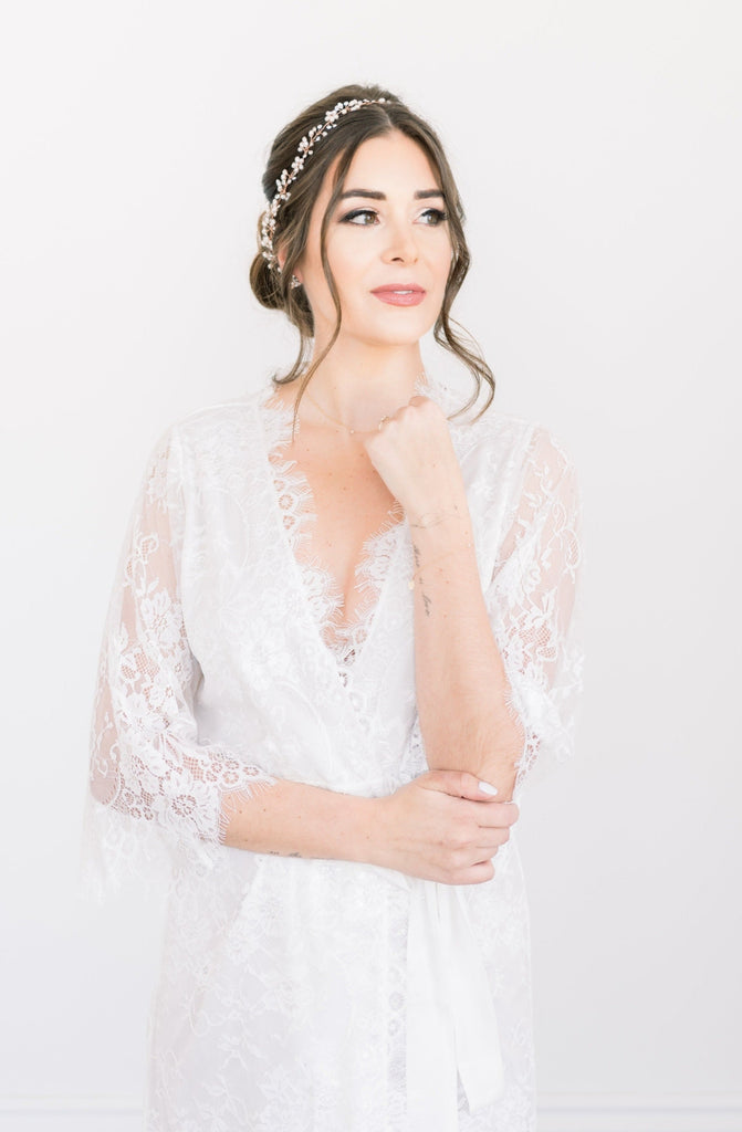 A bride wearing a white lined lace bridal robe in Toronto