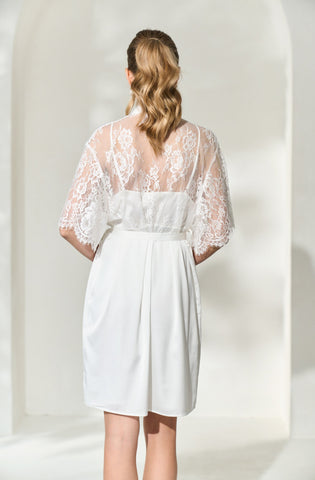 a back view of by catalfo's elegant lace back bridal robe