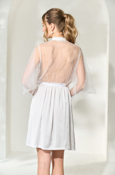 A view of By Catalfo's open back, white Opal wedding robe with pearl embellishments