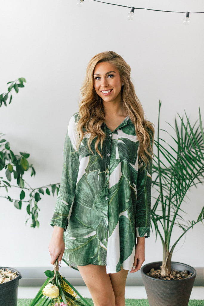 Women wearing a palm print boyfriend shirt