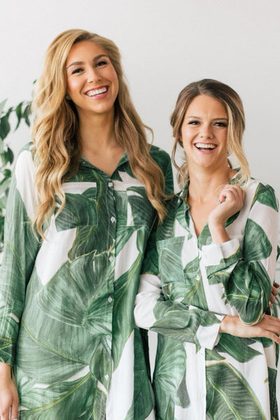 Two women wearing palm print boyfriend shirt