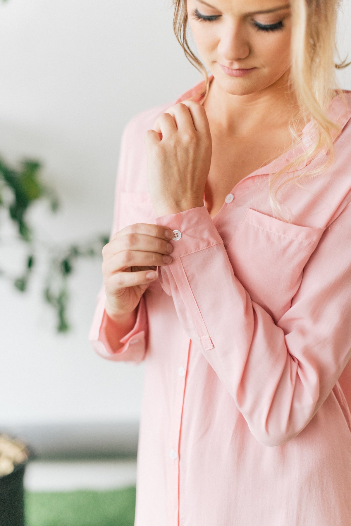 Close up view of sleeve of pink boyfriend shirt