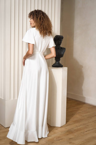 back view of long silk wedding dress with sleeves