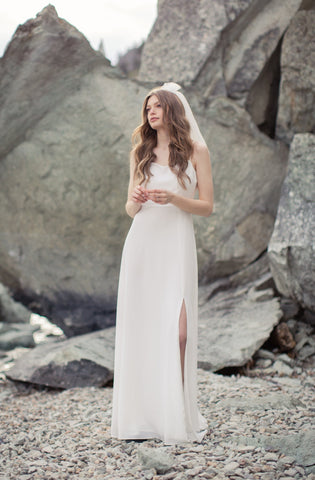 2023 wedding trends: modern high slit wedding gown and short mini veil
