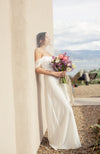  a bride posing with a bouquet for elopement wedding