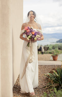 long, modern white off the shoulder custom wedding gown