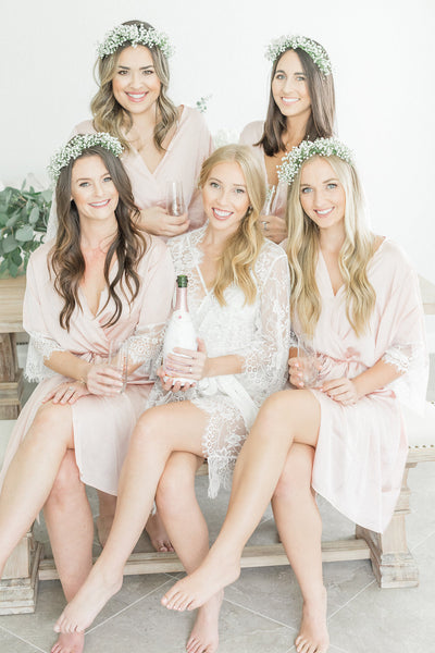 Bridal party blush robes for getting ready, with lace details, from by catalfo in Toronto