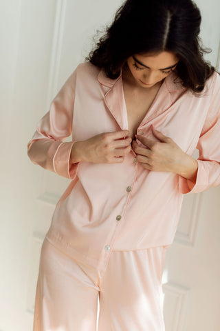 a women wearing comfortable, silky blush pyjama set in Toronto from By Catalfo