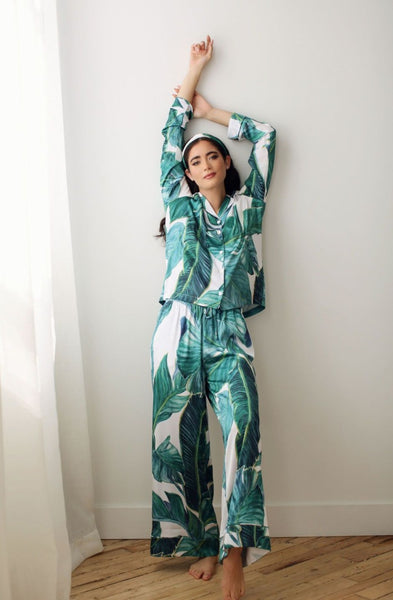 a woman wearing designer pyjamas in a paradiso banana leaf palm print in Toronto