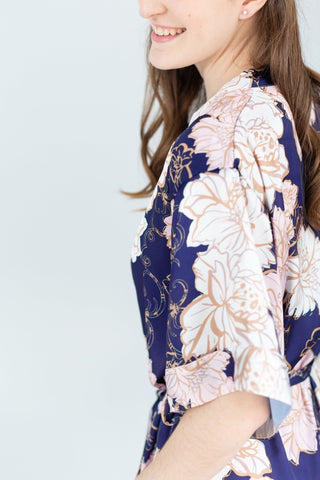 Sleeve detail of a navy, blush and gold floral print bridesmaid robe for getting ready or bridesmaid gift in toronto