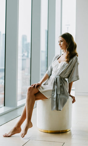 A bride styled in By Catalfo kimono robe for her wedding day at Globe and Mail Center in Toronto