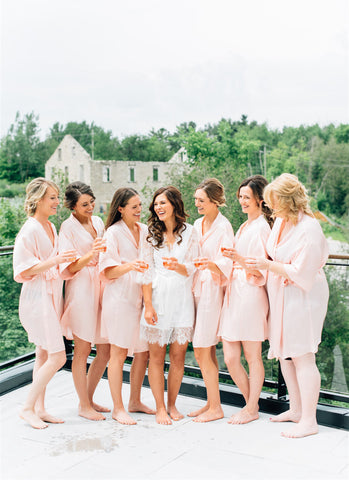 bridesmaids getting ready at Elora Mill wearing By Catalfo silk robes
