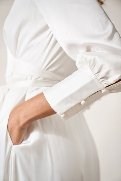 cuff details on a minimal, long sleeve wedding wrap dress